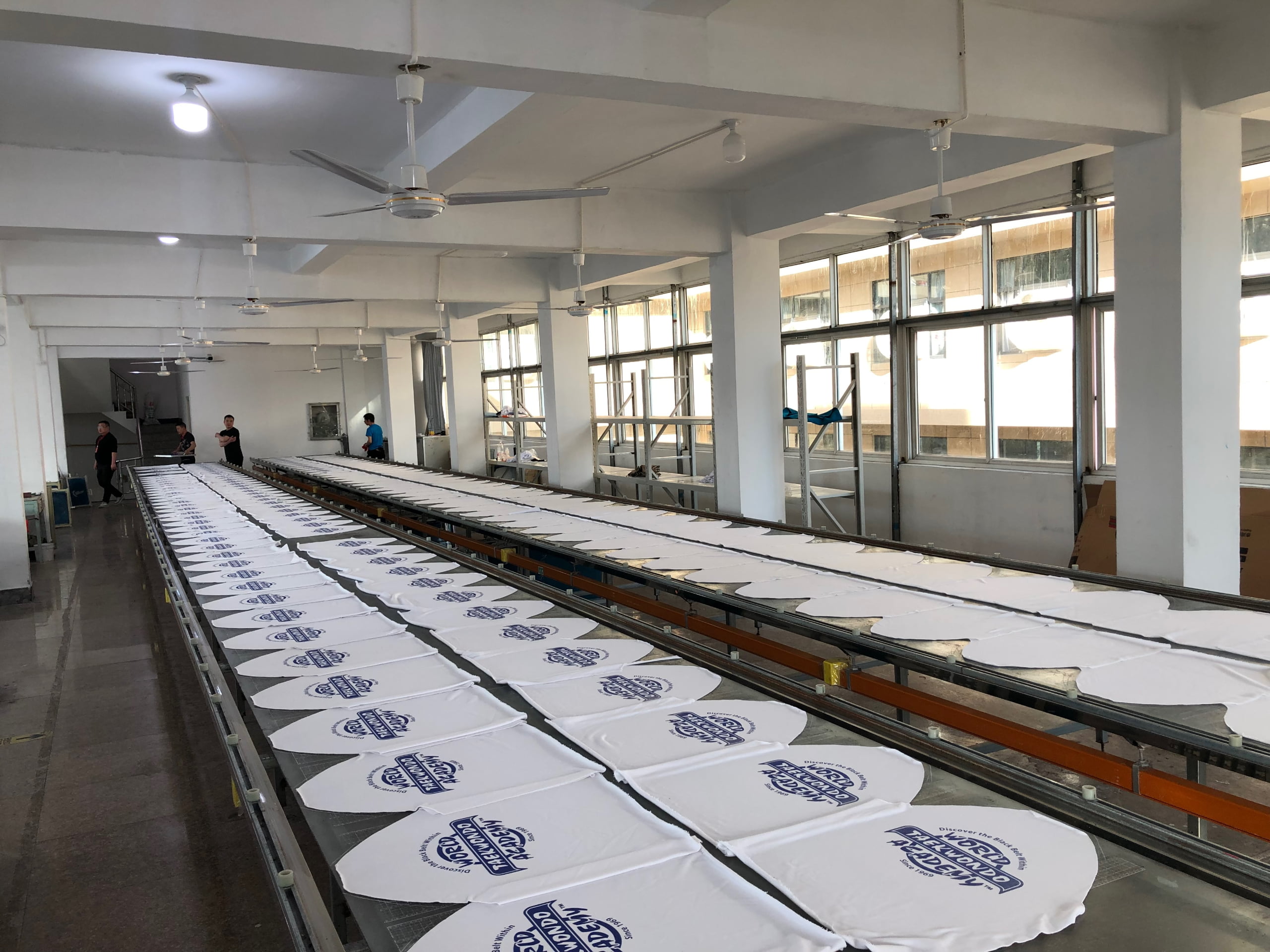 Screen printing process at Garmentown factory -- custom logo and graphic application on garments